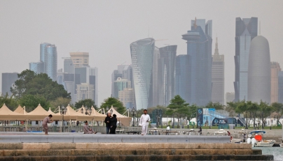 People visit the Corniche area of Doha on a cloudy day on April 9, 2026. (Photo by AFP)
