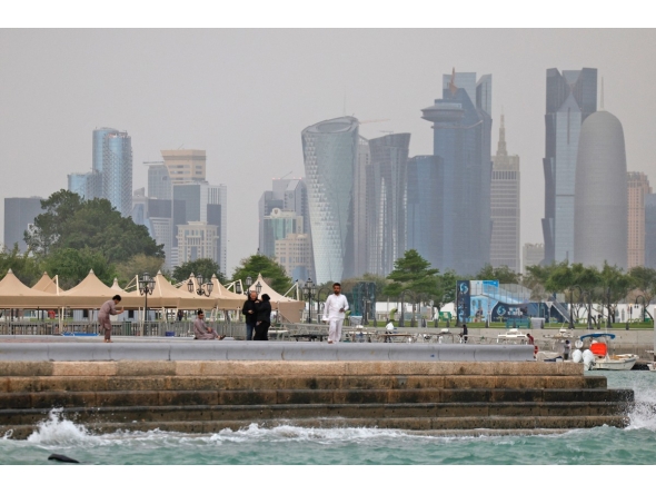 People visit the Corniche area of Doha on a cloudy day on April 9, 2026. (Photo by AFP)
