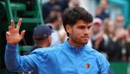 Spain's Carlos Alcaraz gestures after the Monte Carlo ATP Masters Series Tournament final tennis match against Italy's Jannik Sinner on Court Rainier III at the Monte-Carlo Country Club in Roquebrune-Cap-Martin, south-eastern France on April 12, 2026. (Photo by Valery HACHE / AFP)
