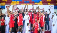 QBF President Mohammed bin Saad Al Mughaseeb applauds as Al Arabi players celebrate with the trophy. 