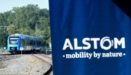 FILE PHOTO: This photograph taken on September 6, 2021 shows Alstom's logo and Alstom's Coradia iLint train, the first in the world to be powered by hydrogen, during its inauguration on the tracks of the Railway Test Center in Petite-Foret, northern France taken on September 6, 2021 . (Photo by Francois Lo Presti/ AFP)