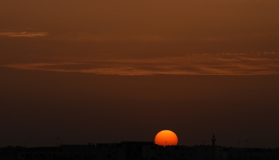 The sun sets over the city of Doha on April 17, 2026. (Photo by AFP)