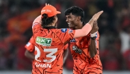 Sunrisers Hyderabad's Indian cricket player Sakib Hussain (R) celebrates with his captain Indian cricket player Ishan Kishan at the Rajiv Gandhi International Stadium in Hyderabad on April 21, 2026. (Photo by Noah Seelam / AFP)
