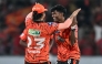 Sunrisers Hyderabad's Indian cricket player Sakib Hussain (R) celebrates with his captain Indian cricket player Ishan Kishan at the Rajiv Gandhi International Stadium in Hyderabad on April 21, 2026. (Photo by Noah Seelam / AFP)