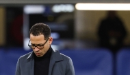 (FILES) Chelsea's English head coach Liam Rosenior looks down ahead of the UEFA Champions League round of 16 second leg football match between Chelsea FC and Paris Saint-Germain (PSG) at Stamford Bridge, west London on March 17, 2026. (Photo by FRANCK FIFE / AFP)