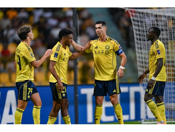 Al Nassr’s Kingsley Coman (centre) celebrates with Cristiano Ronaldo (right) during the semi-final.  