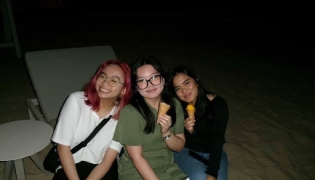 Gwyneth Estomo (GU’27), Lovie Francia (GU-Q’29), and Daphne Soriano (GU-Q’28) during an iftar on March 18, 2026.