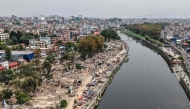 NEPAL-POLITICS-RIGHTS
An aerial view shows squatter settlements demolished by Nepali authorities along the banks of the river Bagmati in Kathmandu on April 25, 2026. (Photo by Prabin Ranabhat / AFP)