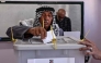 A Palestinian man casts his ballot at a polling station during municipal elections in Palestinian town of Birzeit, north of Ramallah in the Israeli-occupied West Bank on April 25, 2026. (Photo by Zain JAAFAR / AFP)

