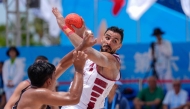 Qatar handball team topped their group after win over Thailand.  