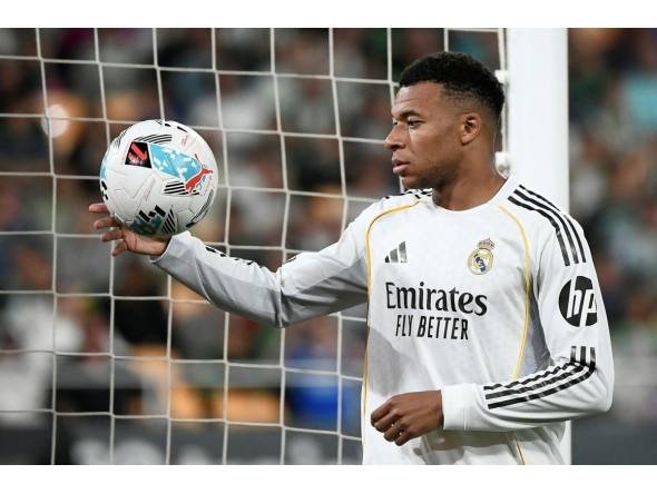 Real Madrid's French forward #10 Kylian Mbappe handles the ball during the Spanish league football match between Real Betis and Real Madrid CF at the La Cartuja stadium in Seville on April 24 , 2026. (Photo by CRISTINA QUICLER / AFP)

