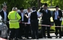 TOPSHOT-BRITAIN-CRIME-POLICE-RELIGION
Local residents look on from outside a cordoned off area in the Golders Green neighbourhood of north London on April 29, 2026, following the stabbing to two people nearby.
 (Photo by JUSTIN TALLIS / AFP)
