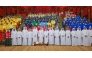 A group photo of H.E the Minister of Municipality with groups of workers inside the celebration hall
