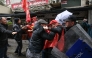 TURKIYE-POLITICS-SOCIAL-LABOUR-MAY DAY-DEMO
Turkish police and protestors scuffle during a May Day (Labour Day) rally, marking international Workers' Day, in Besiktas, a district of Istanbul, on May 1, 2026. 
(Photo by BERK OZKAN / AFP)