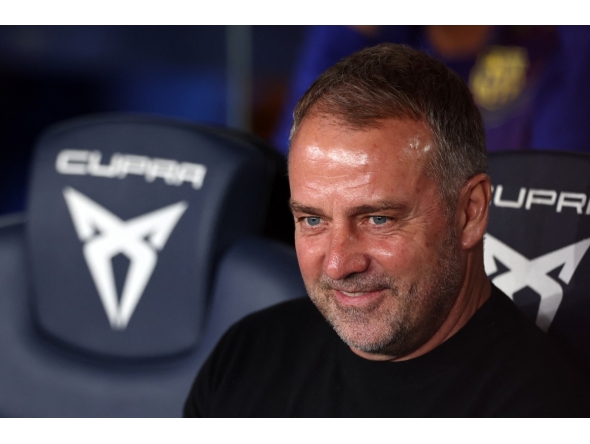 Barcelona's German coach Hans-Dieter Flick smiles before the Spanish league football match between FC Barcelona and RC Celta de Vigo at Camp Nou stadium in Barcelona on April 22 , 2026. (Photo by Josep LAGO / AFP