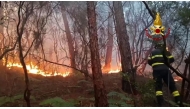 This photo taken and handout on May 1, 2026 by the Vigili del Fuoco, the Italian Corps. of Firefighters, shows firefighters trying to extinguish a major fire on Mount Faeta in the area between the provinces of Lucca and Pisa in the Tuscany region. (Photo by HANDOUT / Vigili del Fuoco / AFP) 