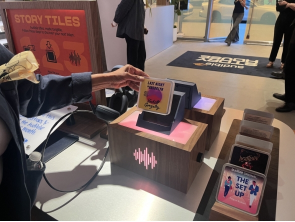 A customer shops at the Audible Story House in New York, on April 30, 2026. The pop-up store labeled as a 