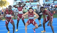 From left: Qatar's Ammar Ismail, Youssef Abdulaziz, Bassem Hmeida and Ashraf Othman celebrate after qualifying for the World Athletics Championships. (AFP)