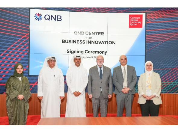 CEO of QNB Group Abdulla Mubarak Al-Khalifa and Dean of CMU-Q Michael Trick with representatives from both institutions during the signing of MoU, yesterday. PIC: MOHAMED ATTAR/THE PENINSULA