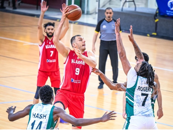 Al Arabi's Elmedin Kikanovic attempts to score.