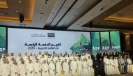 Ashghal officials, programme participants, and guests during the ceremony. 