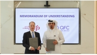 Chief Executive Officer of QFC Mansoor Rashid Al-Khater and Group CEO of Commercial Bank Stephen Moss during the signing of MoU.