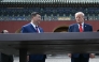 China's President Xi Jinping (C) and US President Donald Trump (R) visit the Temple of Heaven in Beijing on May 14, 2026. (Photo by Brendan Smialowski / Pool / AFP)