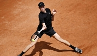 Italy's Jannik Sinner hits a return to Russia's Andrey Rublev during the ATP Rome Open tennis tournament at Foro Italico in Rome (Photo by Tiziana FabiI / AFP)