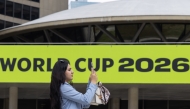 A visitor films the FIFA World Cup 2026-themed decorations at Nathan Phillips Square in Toronto, Canada, on May 11, 2026. (Photo by Zou Zheng/Xinhua)
