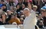 Pope Leo XIV waves to the crowd during the weekly general audience at St Peter's Square in The Vatican on April 8, 2026. Photo by Tiziana FABI / AFP