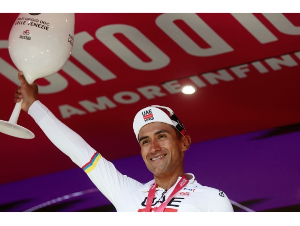 UAE Team Emirates - XRG Ecuadorian rider Jhonatan Narvaez celebrates on the podium after winning the 8th stage of the Giro d'Italia 2026. (Photo by Luca Bettini / AFP)
