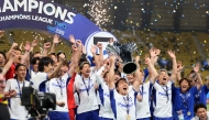 Gamba Osaka's players pose with the trophy after winning the 2026 AFC Champions League Two final football match between Al-Nassr and Gamba Osaka at the Al-Awwal Park Stadium in Riyadh on May 16, 2026. (Photo by Fayez NURELDINE / AFP)