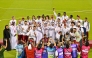 Qatar Athletics Federation President Mohammed Issa Al-Fadala celebrates with Team Qatar's medal winners.