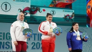 Qatar’s Ouisal Ikhlef (left) delivered an impressive performance at the Asian Weightlifting Championships in Gandhinagar, India,