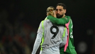 Manchester City's Italian goalkeeper #25 Gianluigi Donnarumma hugs Manchester City's Norwegian striker #09 Erling Haaland after the English Premier League football match between Bournemouth and Manchester City at the Vitality Stadium in Bournemouth, southern England on May 19, 2026. (Photo by Glyn KIRK / AFP)

