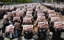 Members of the Samsung Electronics labour union hold signs reading 