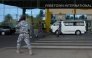 Security escort migrants in a National Public Health Agency (NPHA) after their arrival at Freetown International Airport, formerly known as Lungi International Airport, in Lungi on May 20, 2026. (Photo by AFP)