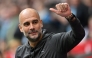(FILES) Manchester City's Spanish manager Pep Guardiola waves to the fans ahead of the English FA Cup semi-final football match between Manchester City and Sheffield United at Wembley Stadium in north west London on April 22, 2023. (Photo by Glyn KIRK / AFP)