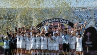 Naegohyang Women's FC players celebrate with the trophy during the victory ceremony after the AFC Women's Champions League final football match between North Korea's Naegohyang Women's FC and Japan's Tokyo Verdy Beleza in Suwon on May 23, 2026. (Photo by Jung Yeon-je / AFP)
