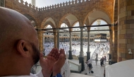 A Muslim worshipper prays near the Kaaba, Islam's holiest shrine, at the Grand Mosque complex in the holy city of Makkah on May 22, 2026, ahead of the annual Hajj pilgrimage. (Photo by Zain JAAFAR / AFP)