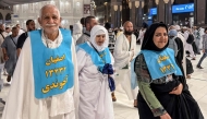 Iranian pilgrims (front) pose for a photograph after performing the Umrah minor pilgrimage at the Grand Mosque complex in the holy city of Mecca on May 23, 2026, ahead of the annual Hajj pilgrimage. (Photo by AFP)