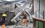 Rescuers remove metal rubbles as they search for survivors on a collapsed building in Angeles City, Pampanga province, north of Manila on May 24, 2026. Nineteen people are feared trapped after a building under construction near Manila collapsed early on May 24, a local government official said. (Photo by Ted ALJIBE / AFP)