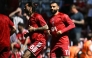 Liverpool's Hungarian midfielder #08 Dominik Szoboszlai (L) and Liverpool's Egyptian striker #11 Mohamed Salah (R) warm up ahead of the English Premier League football match between Liverpool and Brentford at Anfield in Liverpool, north west England on May 24, 2026. (Photo by Paul ELLIS / AFP)