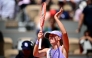 Poland's Iga Swiatek acknowledges the crowd as she celebrates her victory in her women's singles match against Australia's Emerson Jones on day 2 of the French Open tennis tournament on Court Philippe-Chatrier at the Roland-Garros Complex in Paris on May 25, 2026. (Photo by JULIEN DE ROSA / AFP)

