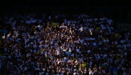 Spurs fans watch in the sunshine during the English Premier League football match between Tottenham Hotspur and Everton at the Tottenham Hotspur Stadium in London, on May 24, 2026. Photo by Ben STANSALL / AFP