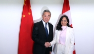 Canada's Minister of Foreign Affairs Anita Anand (R) shakes hands with China's Minister of Foreign Affairs Wang Yi ahead of a bilateral meeting in Ottawa, on May 29, 2026. (Photo by Dave Chan / AFP)
 