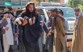 A man carries an injured girl to a hospital for treatment after a truck carrying Afghan families overturned in Jalalabad on May 30, 2026. (Photo by Aimal Zahir / AFP)