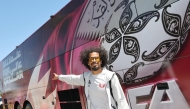 Qatar's Akram Afif stands next to the team bus upon Al Annabi's arrival in Santa Barbara.
