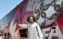 Qatar's Akram Afif stands next to the team bus upon Al Annabi's arrival in Santa Barbara.
