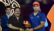 Rajasthan Royals' Indian cricket player Vaibhav Sooryavanshi (R) is awarded the 